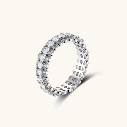 Sterling silver eternity ring with continuous row of brilliant moissanite stones in scalloped crown setting with milgrain detail